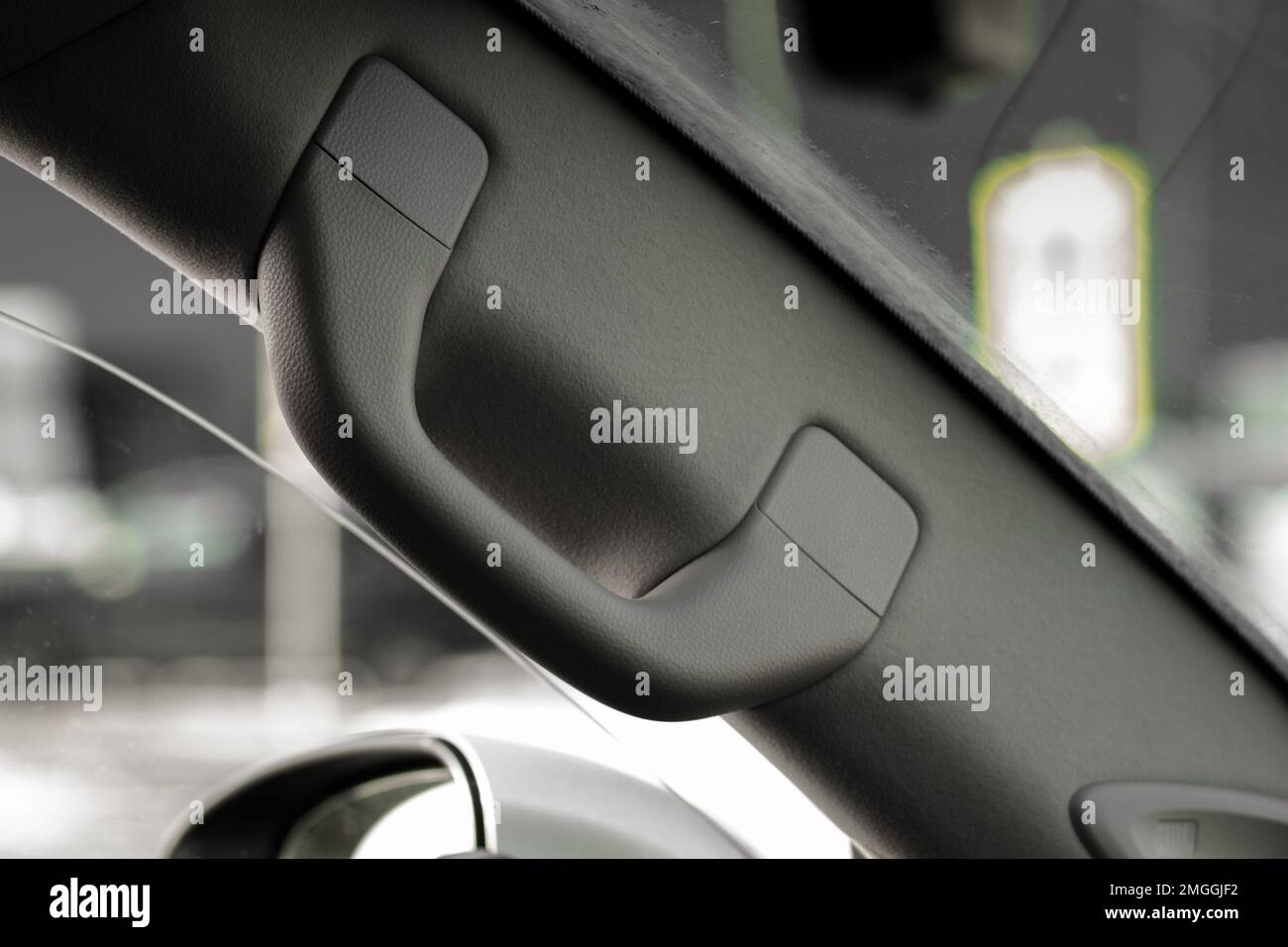 Modern car grab handle, car interior details. Car grab handler for the passenger. Car ceiling