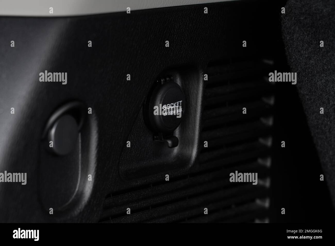 Modern car outlet socket. Closed 12V power outlet socket Stock Photo