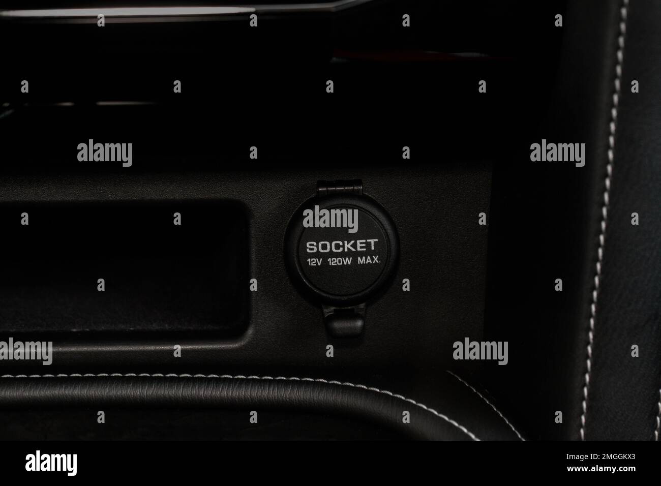 12V power outlet socket in the car. Closed socket in car Stock Photo