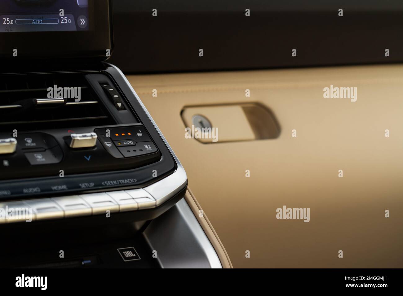 Seat heater button. Seat heating in the car switched on Stock Photo Alamy