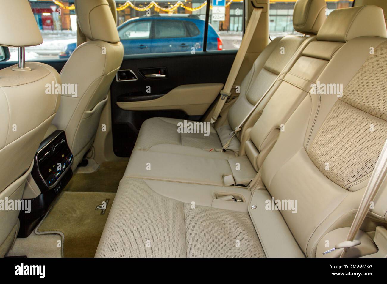 Modern SUV car inside. Leather light back passenger seats in modern