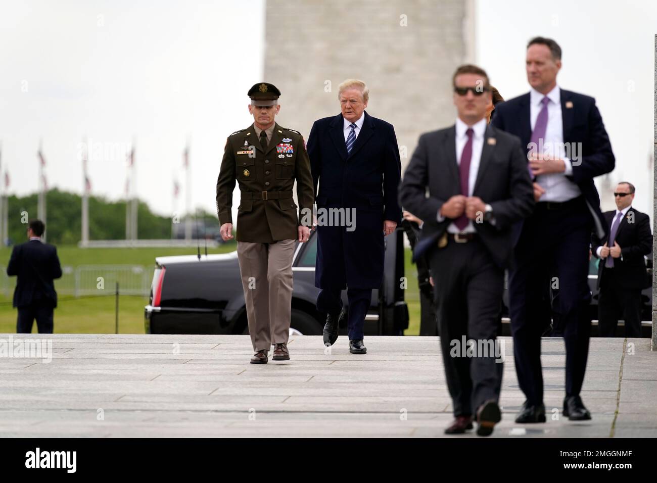 President Donald Trump arrives for a wreath laying ceremony at the ...