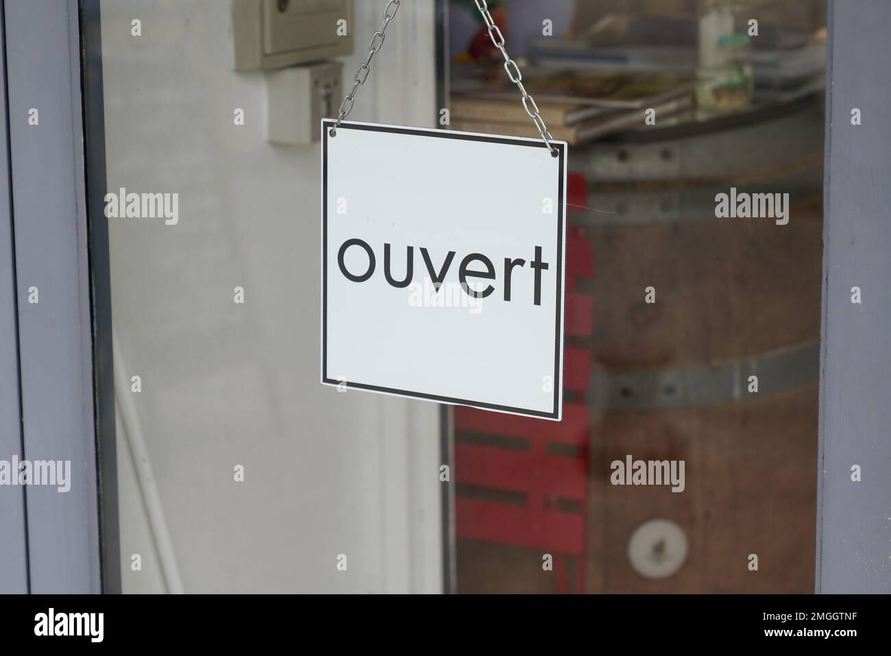 ouvert french text means come in open boutique text sign board on