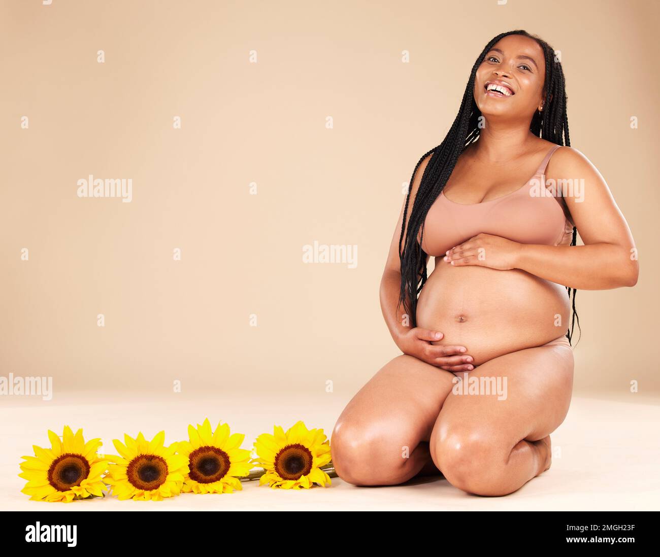 Pregnant woman black background black background hi-res stock photography and images