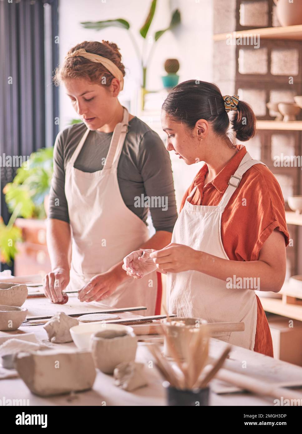 Pottery, ceramic and teacher with student in training