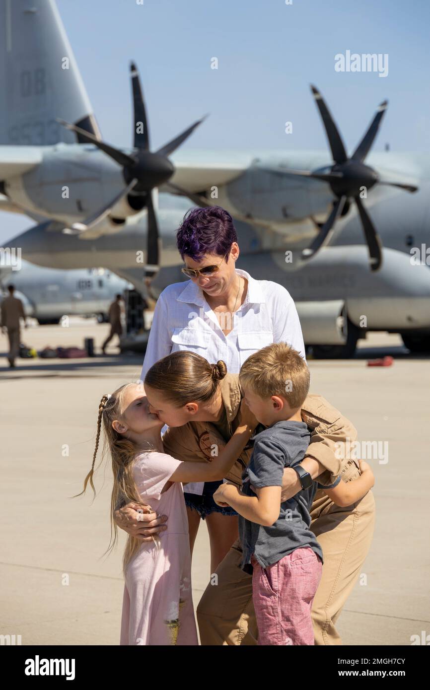 U.S. Marine Corps Gunnery Sgt. Lindsey Schindler with Marine Aerial Refueler Transport Squadron 352, Marine Aircraft Group 11, 3rd Marine Aircraft Wing, embraces her family at the Combined Joint Task Force-Horn of Africa homecoming, on MCAS Miramar, California, Aug. 22, 2022. The deployment was a successful integration of elements of three Fleet Marine Force squadrons to provide critical rapid personnel recovery and medical evacuation capabilities to U.S. and partner forces operating in East Africa. Stock Photo
