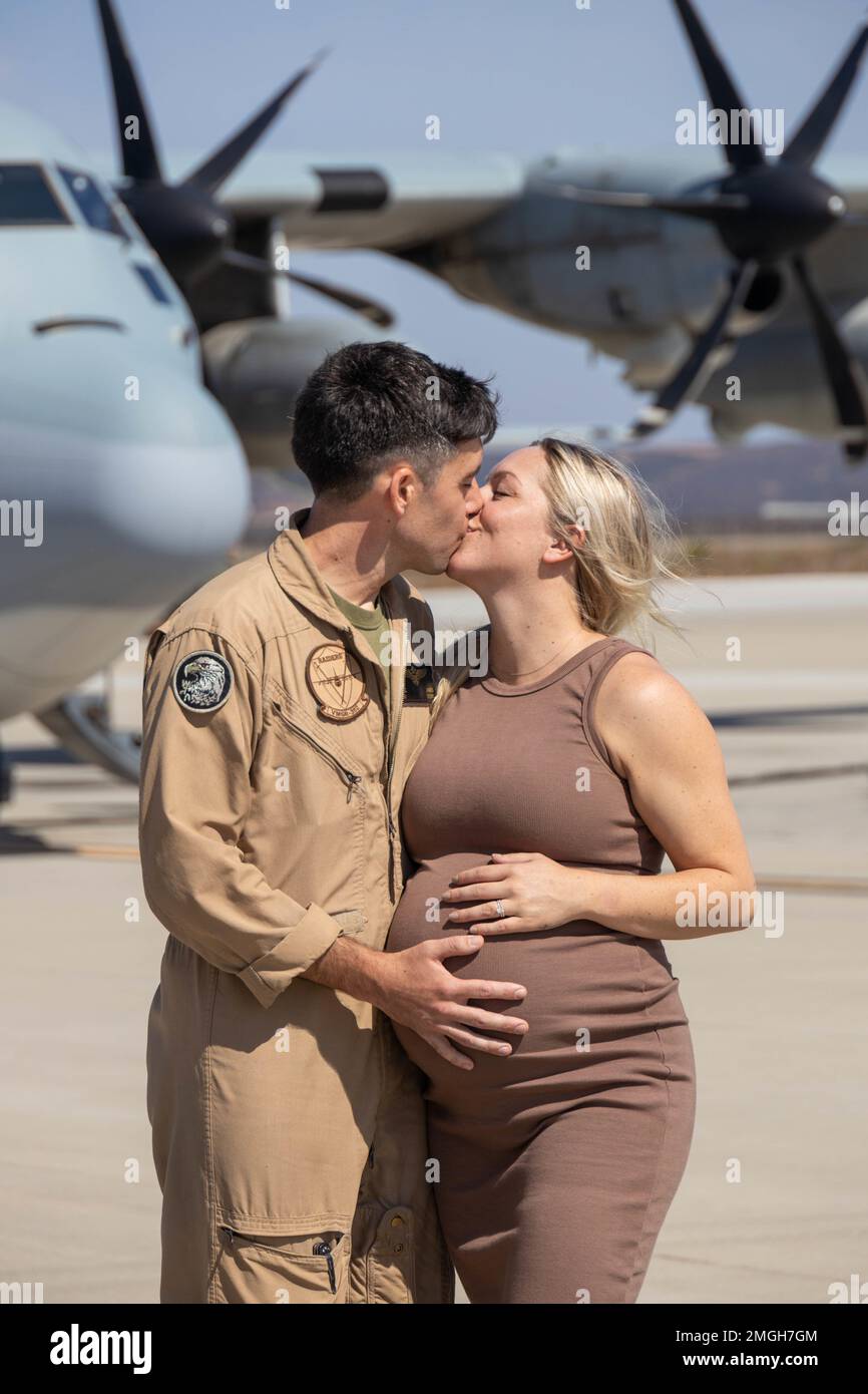 U.S. Marine Corps Maj. William James with Marine Aerial Refueler Transport Squadron 352, Marine Aircraft Group 11, 3rd Marine Aircraft Wing, embraces his spouse at the Combined Joint Task Force-Horn of Africa homecoming, on MCAS Miramar, California, Aug. 22, 2022. The deployment was a successful integration of elements of three Fleet Marine Force squadrons to provide critical rapid personnel recovery and medical evacuation capabilities to U.S. and partner forces operating in East Africa. Stock Photo
