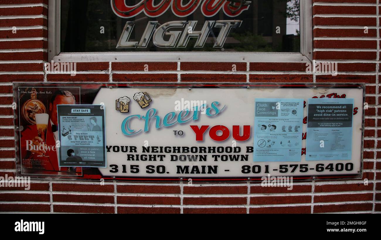"Social distancing" signs are shown on the outside of Cheers to You bar