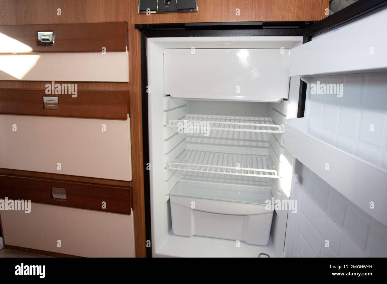 rv open empty fridge in camper van Stock Photo Alamy