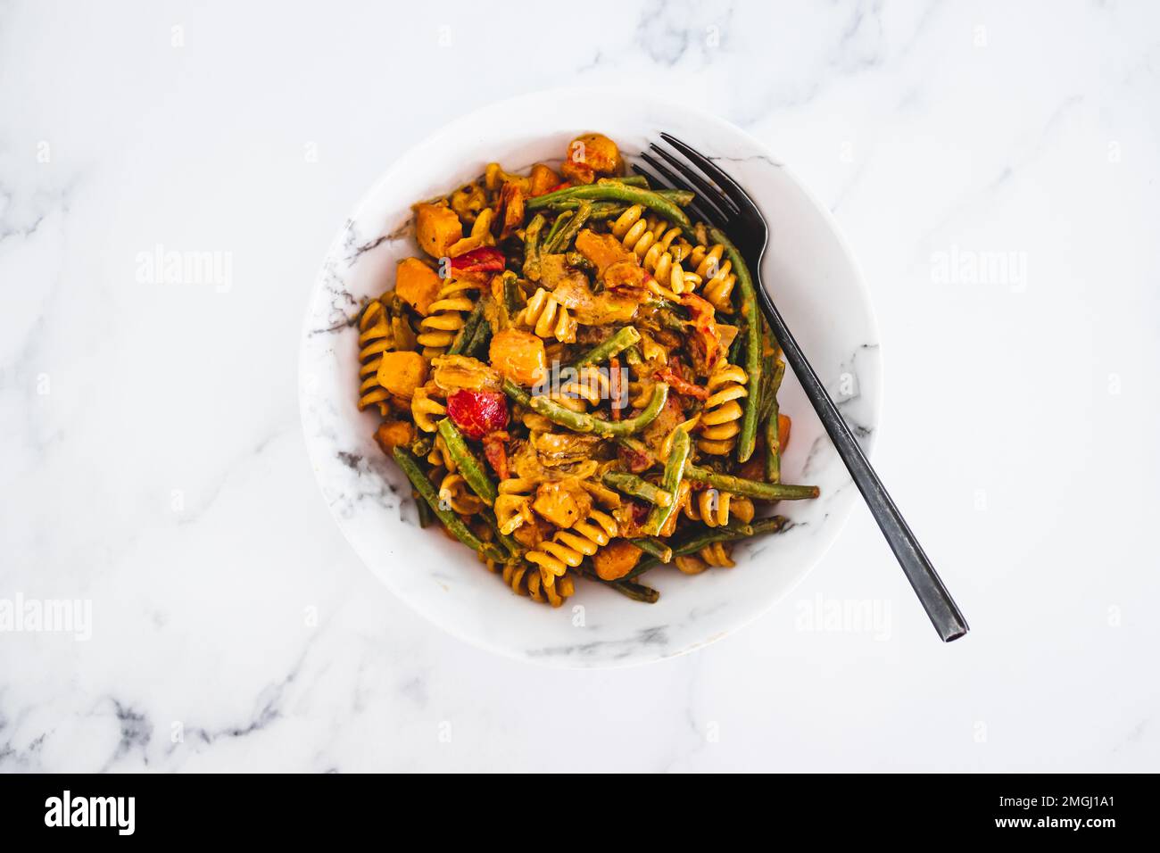 plant-based vegetable pasta with creamy sauce, healthy vegan food recipes Stock Photo