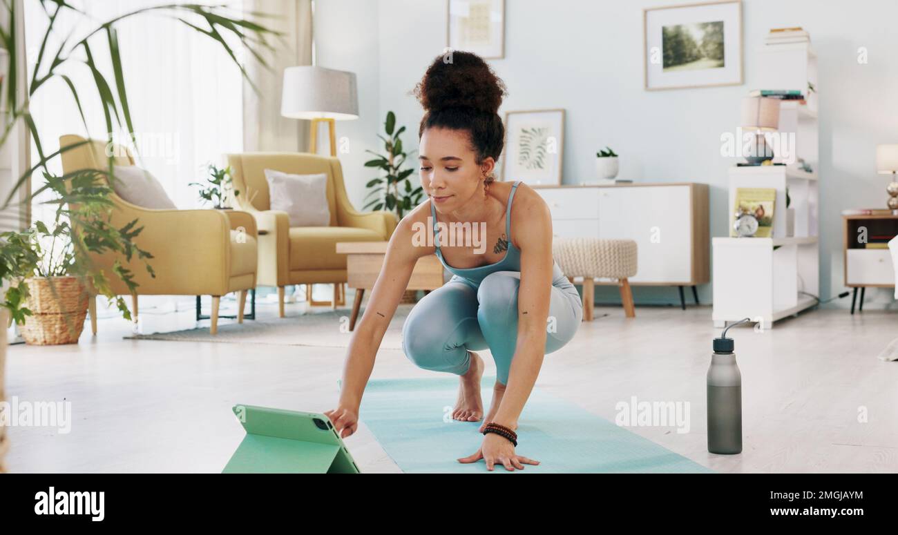 Exercise, yoga and tablet with fitness woman streaming online class, tutorial or live stream on