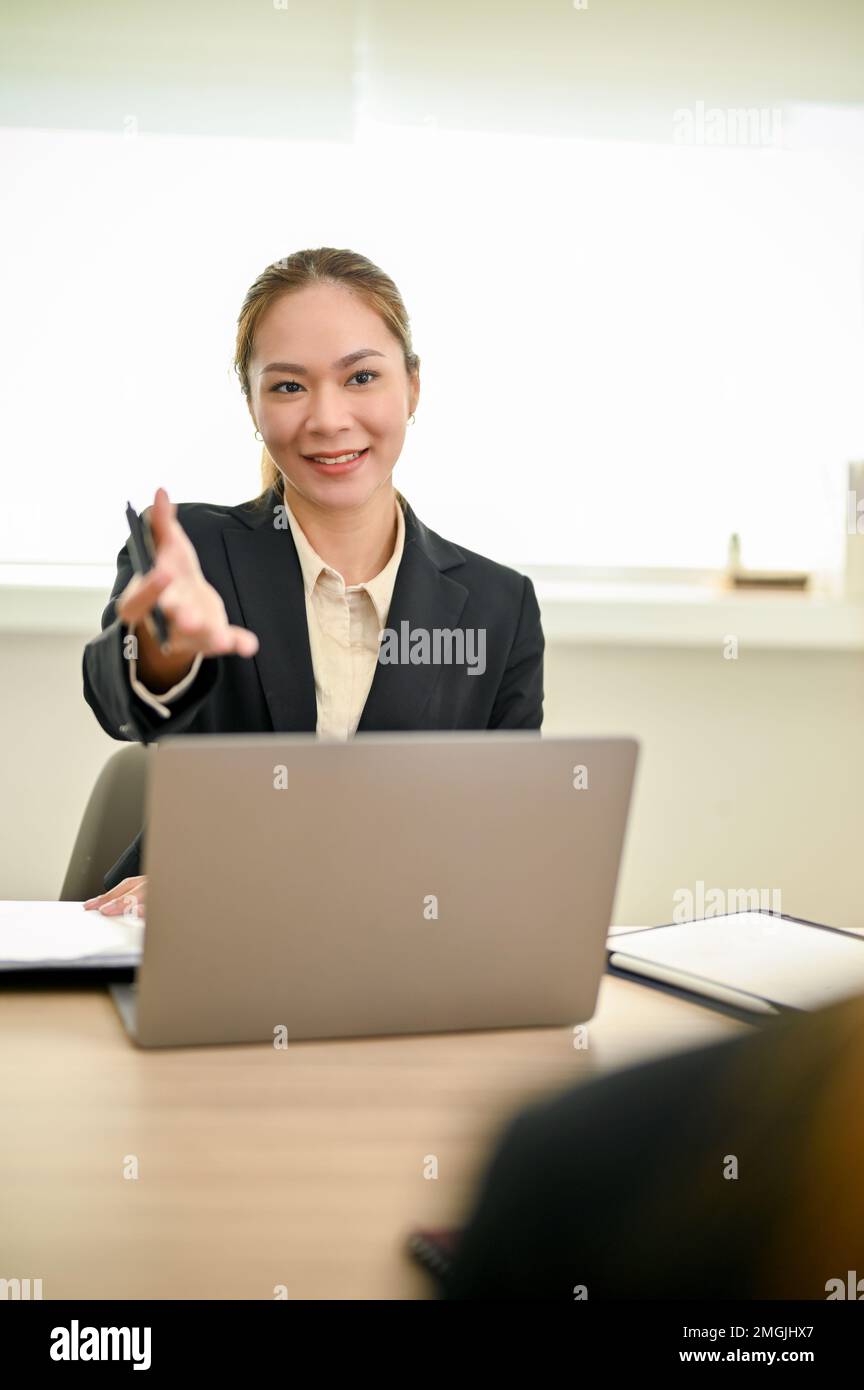 Portrait, Professional millennial Asian female HR recruiter or interviewer interviewing a candidate in the meeting room. job recruitment and interview Stock Photo