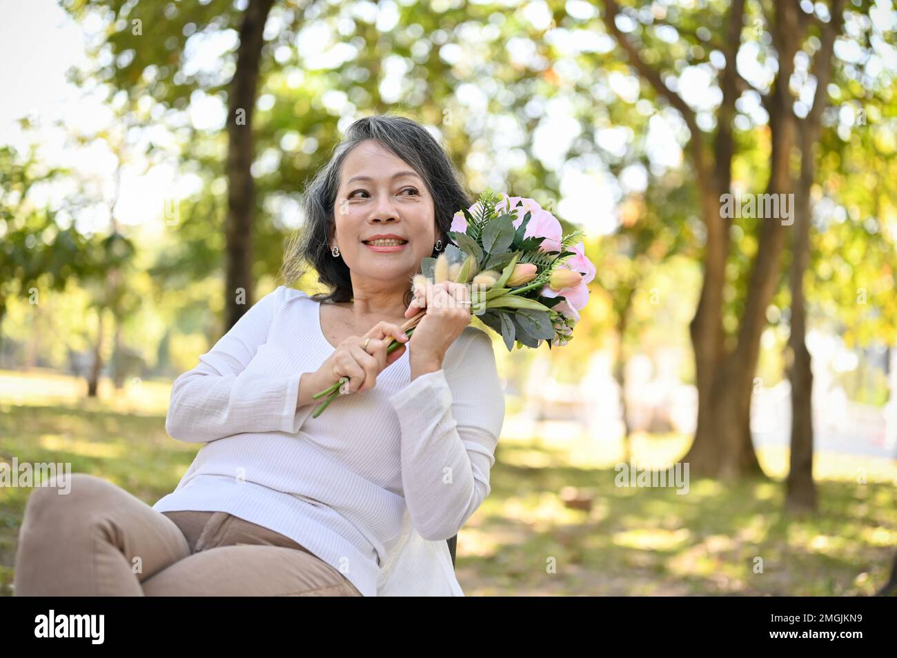 Charming asian 60s aged hi-res stock photography and images - Alamy