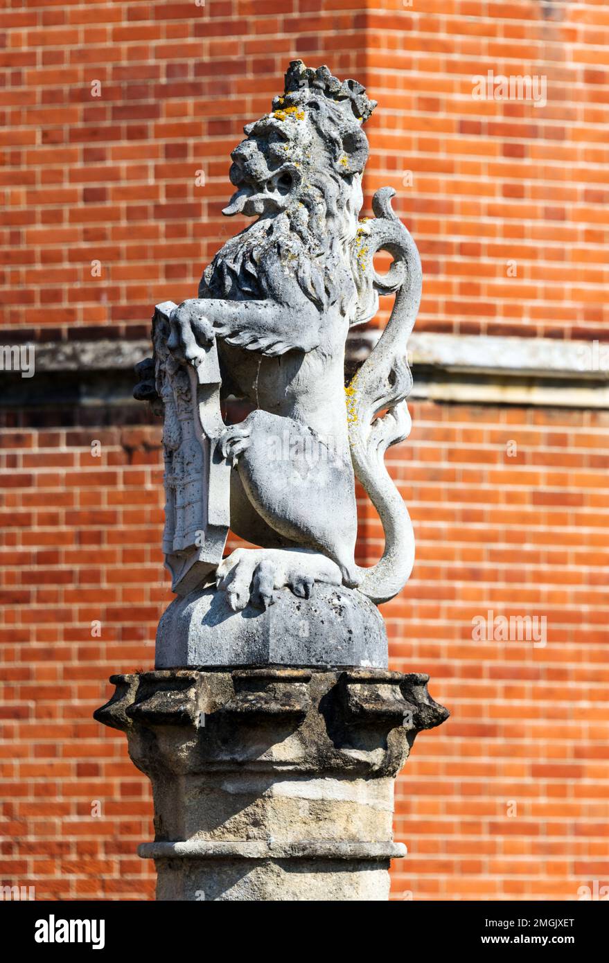 The white lion of Mortimer, one of 10 heraldic animals, called the King Beasts, that stand on the bridge over the moat leading to the great gatehouse, Stock Photo