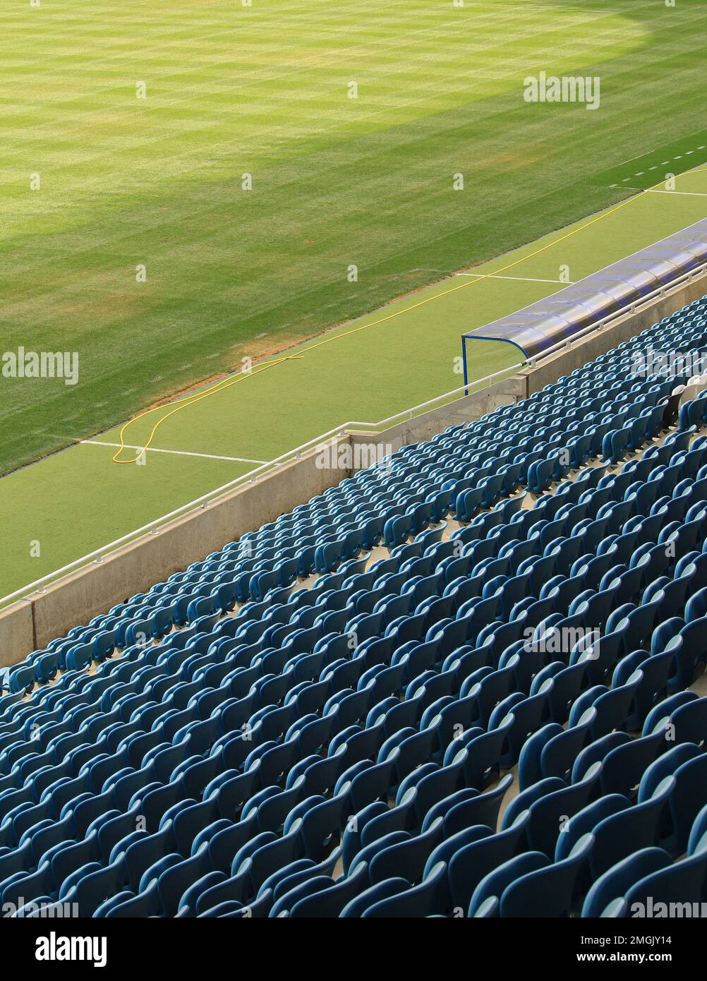 Tribune sports stadium with empty chairs Stock Photo - Alamy