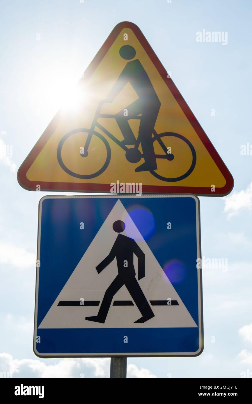 Round road sign depicting white bicycle on blue background, meaning