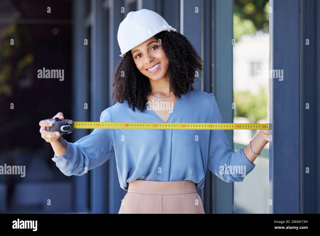 Construction worker, happy in portrait with black woman and tape measure, architecture and building industry. Measurement, architect and engineering Stock Photo