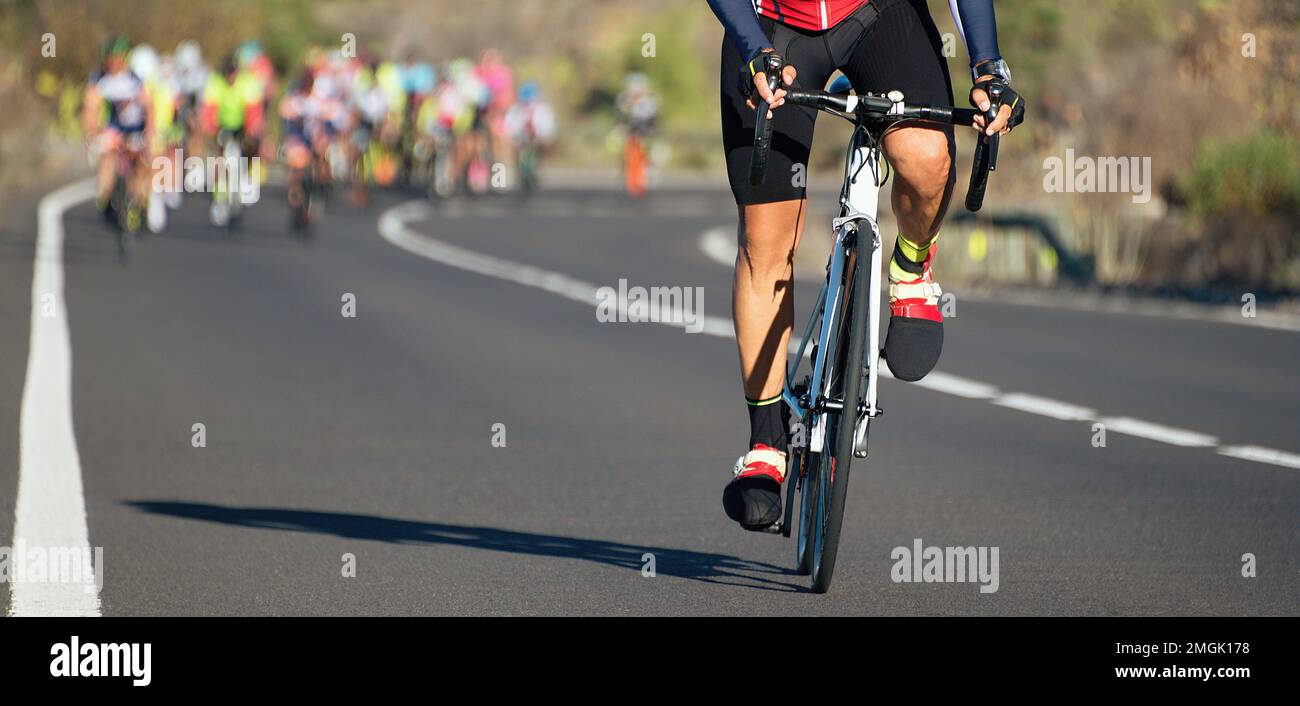 Cycling competition,cyclist athletes riding a race,climbing up a hill ...
