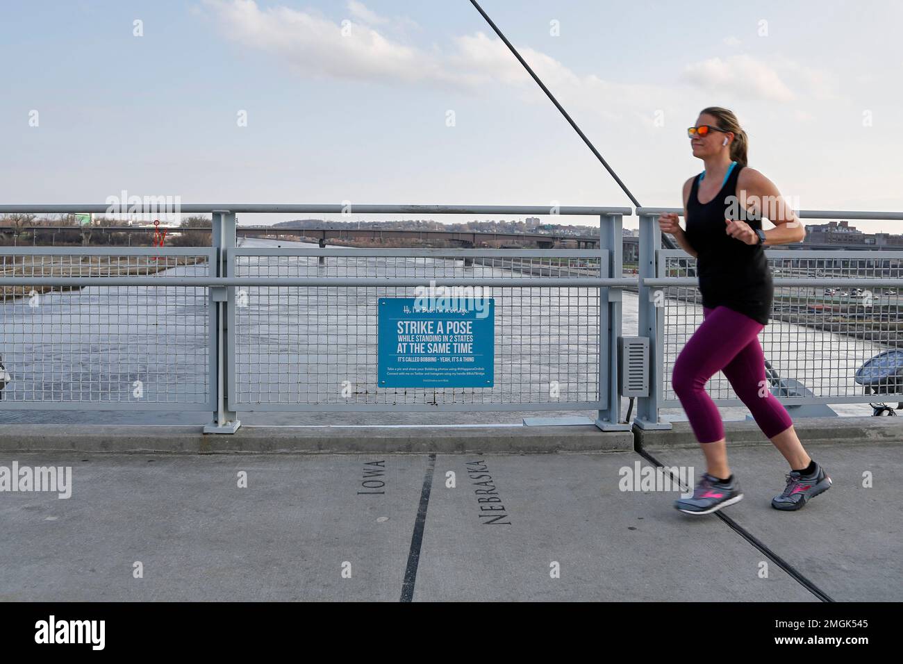 https://c8.alamy.com/comp/2MGK545/in-this-april-6-2020-photo-a-jogger-on-the-bob-kerrey-pedestrian-bridge-over-the-missouri-river-is-about-to-cross-over-from-omaha-neb-to-council-bluffs-iowa-while-most-governors-have-imposed-stay-at-home-orders-to-slow-the-spread-of-the-coronavirus-leaders-of-a-handful-of-states-have-rejected-such-action-ap-photonati-harnik-2MGK545.jpg
