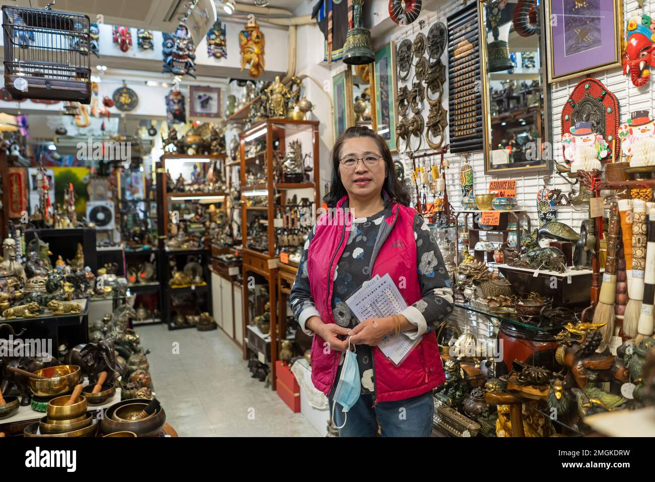 Hong Kong - December 2022  Portrait of woman female antiques store owner in Stanely Market Stock Photo