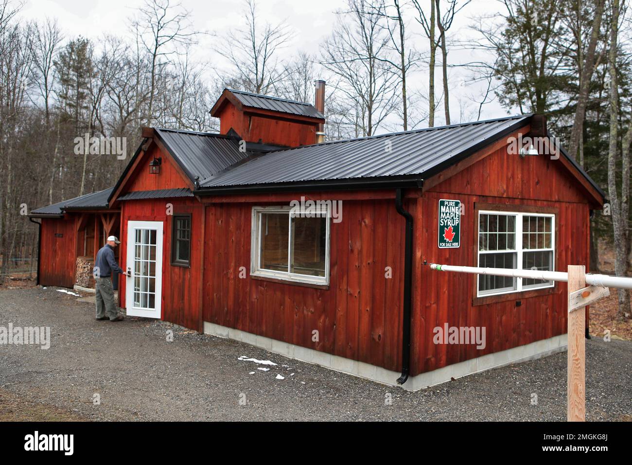 In this Wednesday, April 1, 2020 photo, Scott Dunn goes to work at the Dunn Family Maple sugar