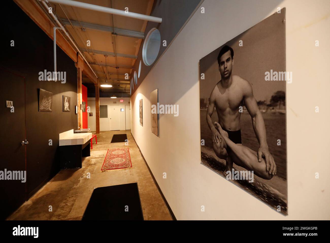 In this April 1, 2020, photo, the long hallway inside Naveed Abidi's Bikram  Yoga West is empty, of members after being closed by the city last week,  tipped off by several residents