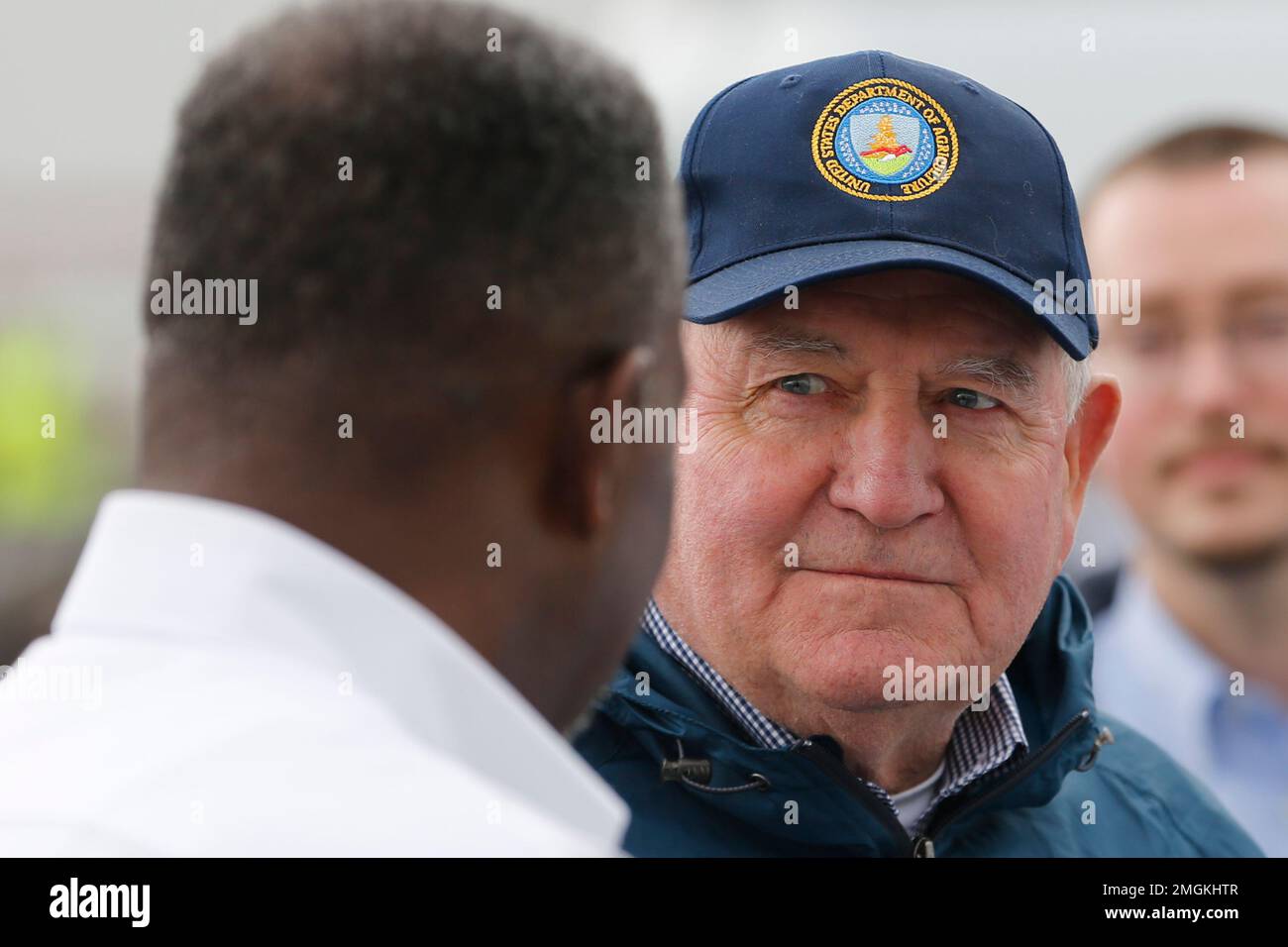 Agriculture Secretary Sonny Perdue, right, talks with Walmart truck
