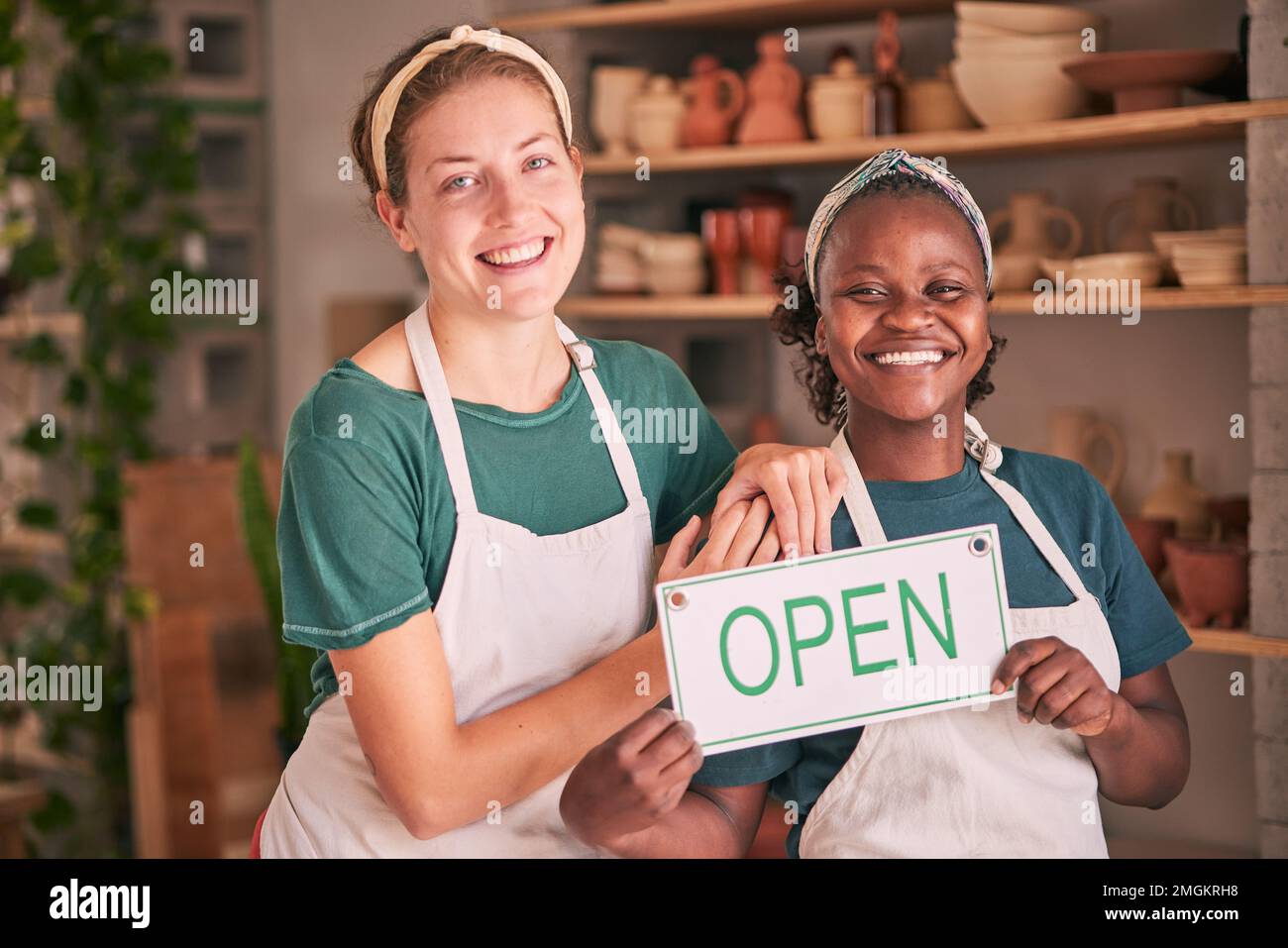 Small business, pottery and women team with open sign for creative workshop, art studio and startup. Smile, teamwork and entrepreneurs ready for Stock Photo