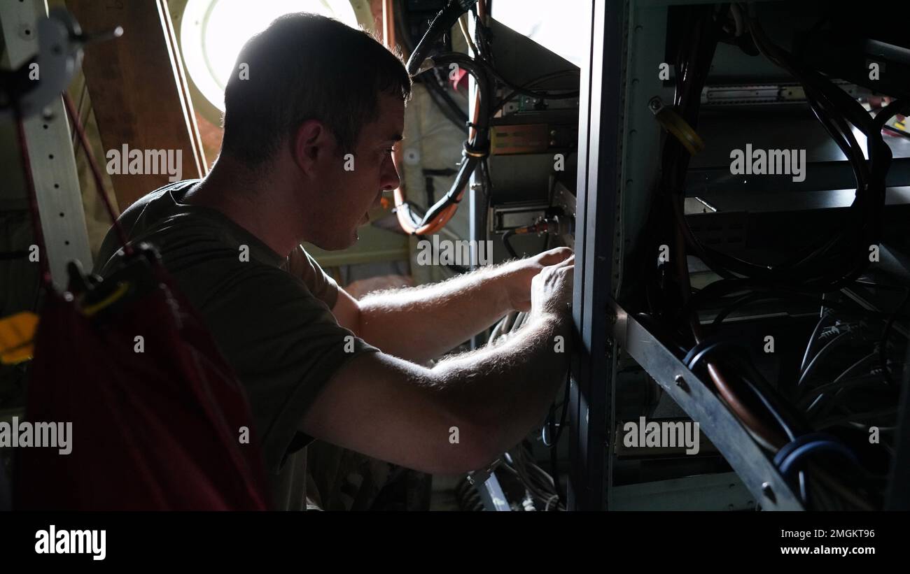 Tech. Sgt. Russell Kober, 403rd Maintenance Squadron metereological equipment technician, changes out the outdated computer system for an updated one on the dropsonde operator pallet on the WC-130J Super Hercules completing an upgrade on the system August 24, 2022. Stock Photo