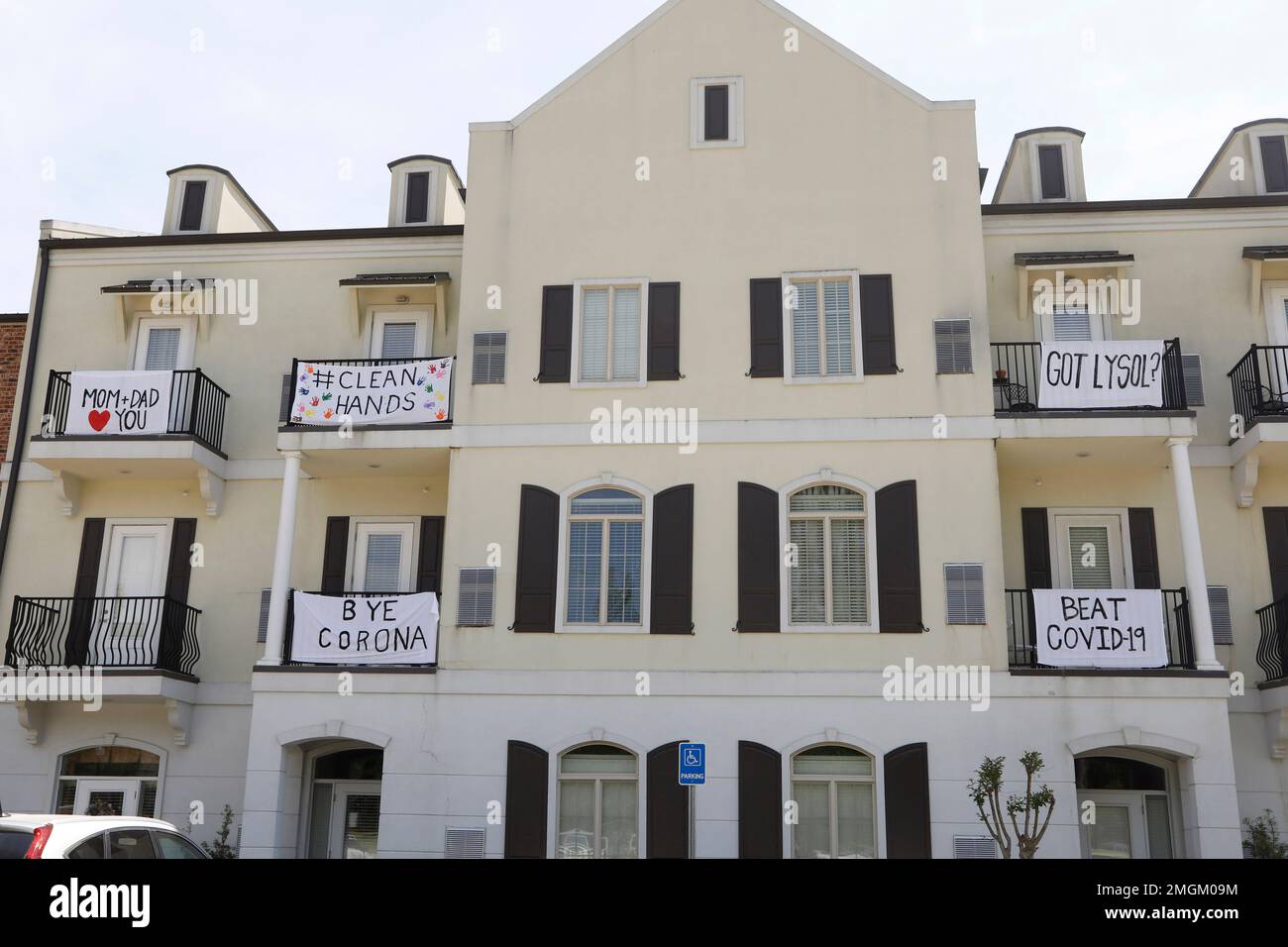 Messages of support hang on the balconies of the Beau Ridge, an ...