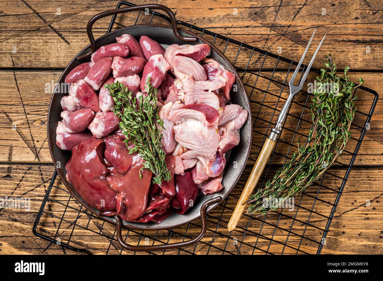 Raw bird giblets meat set, chicken offals, liver, hearts, gizzards