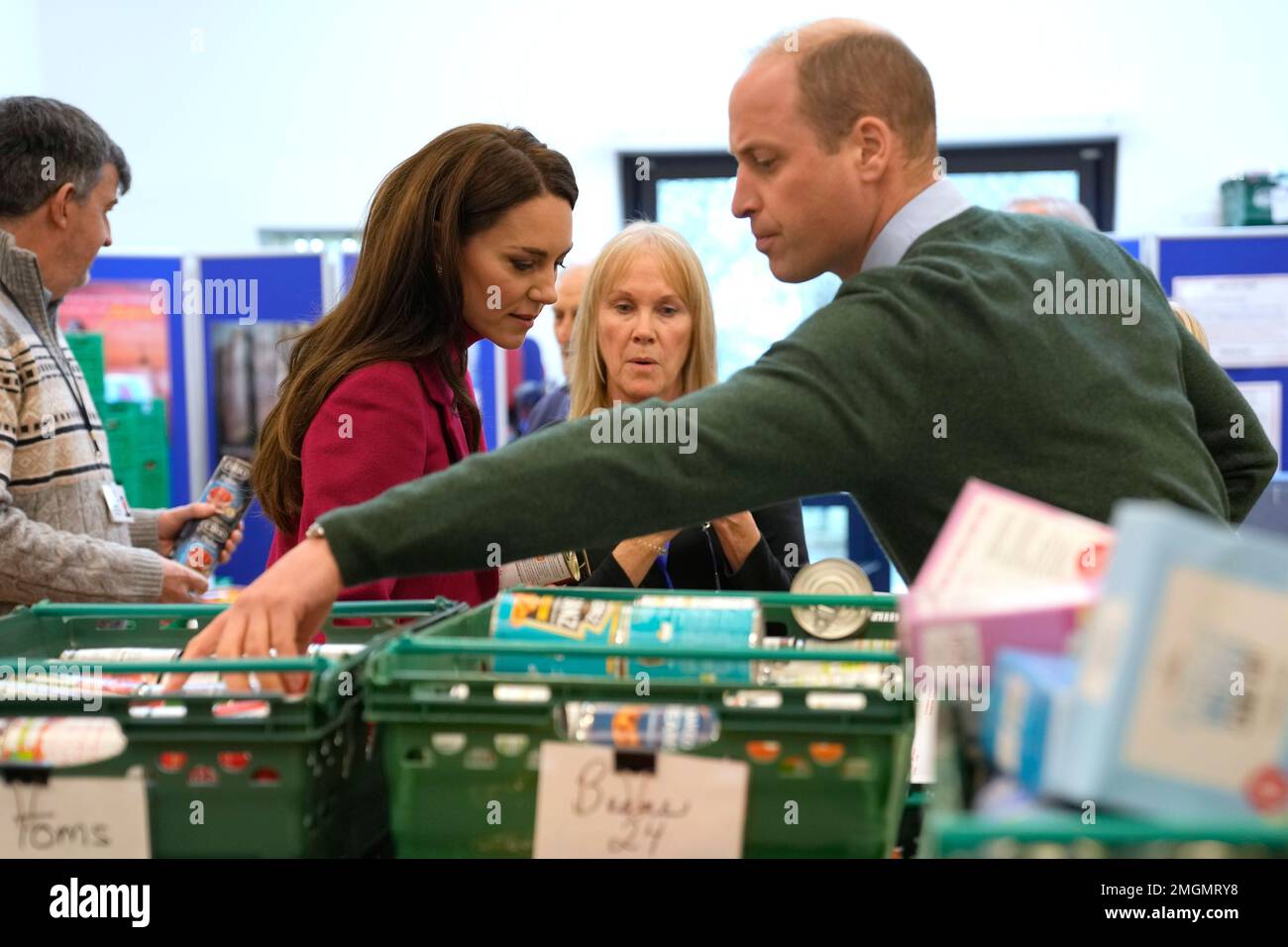 The Prince (right) and Princess (second left) of Wales check food