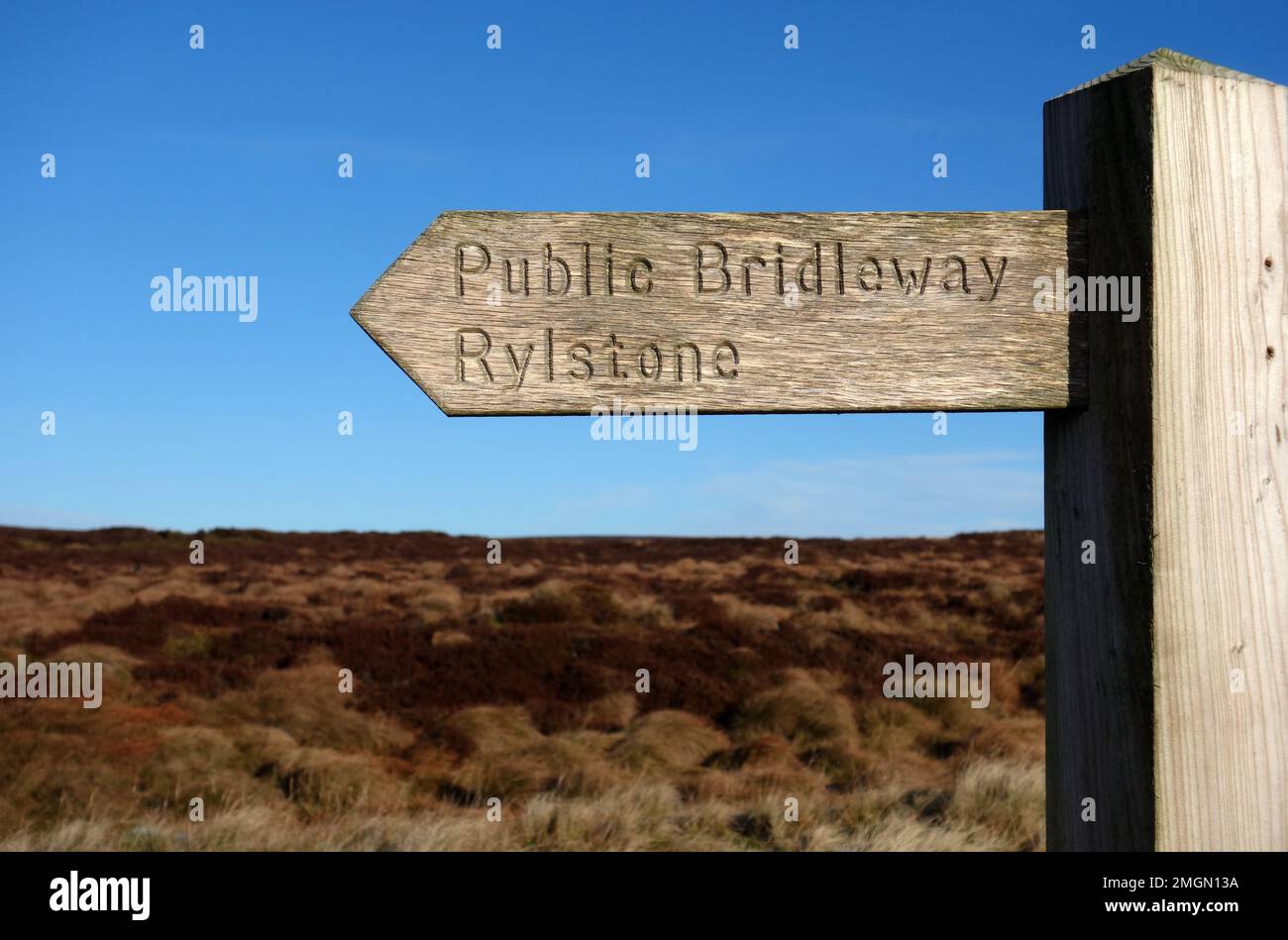 Wooden Signpost for Public Bridleway from Rlystone to Bolton Hall in the Yorkshire Dales National Park, England, UK. Stock Photo