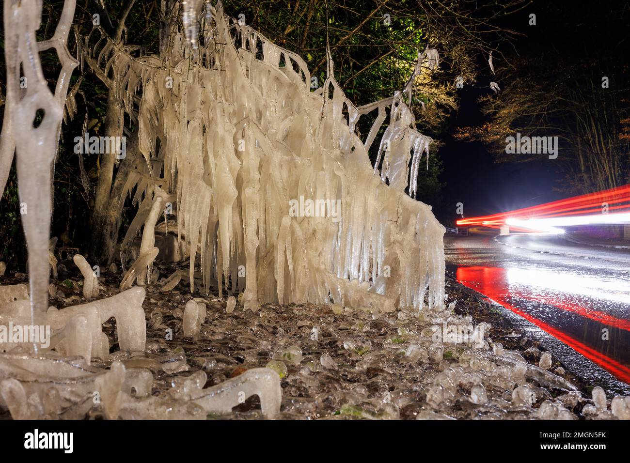 Ice formation at the side of a busy road, caused by traffic