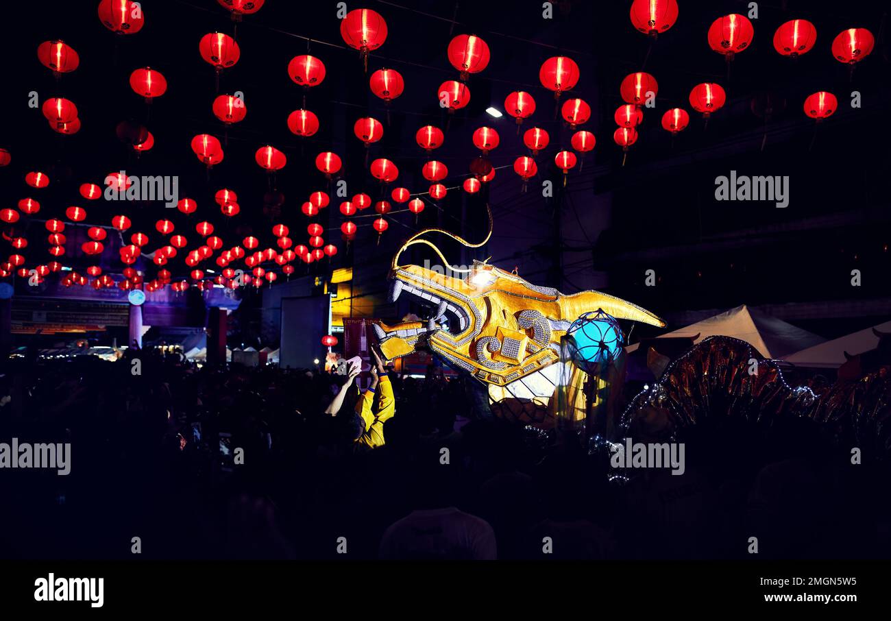 Dragon head decoration at night market with red lantern lights for the Chinese New year in Bangkok Chinatown in Thailand Stock Photo