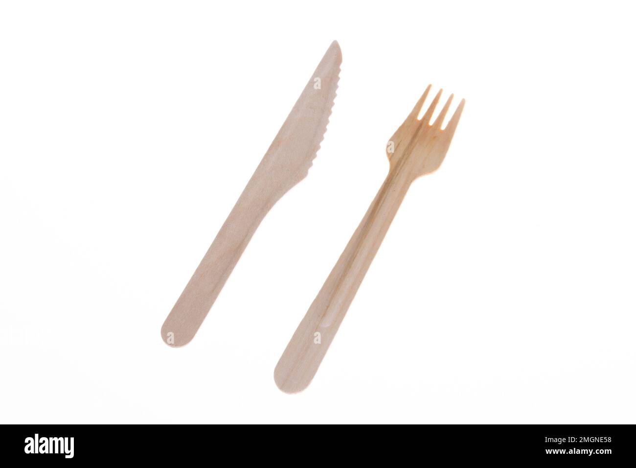 wooden fork and knife made from recycled paper and wood on white