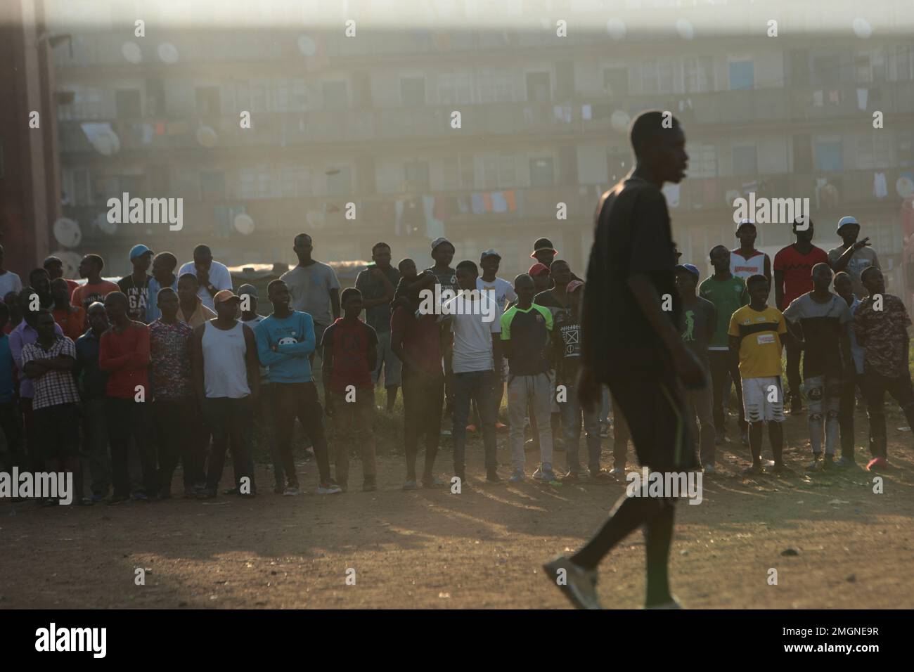 A crowd gathers to watch a soccer match in Harare, Zimbabwe, Sunday