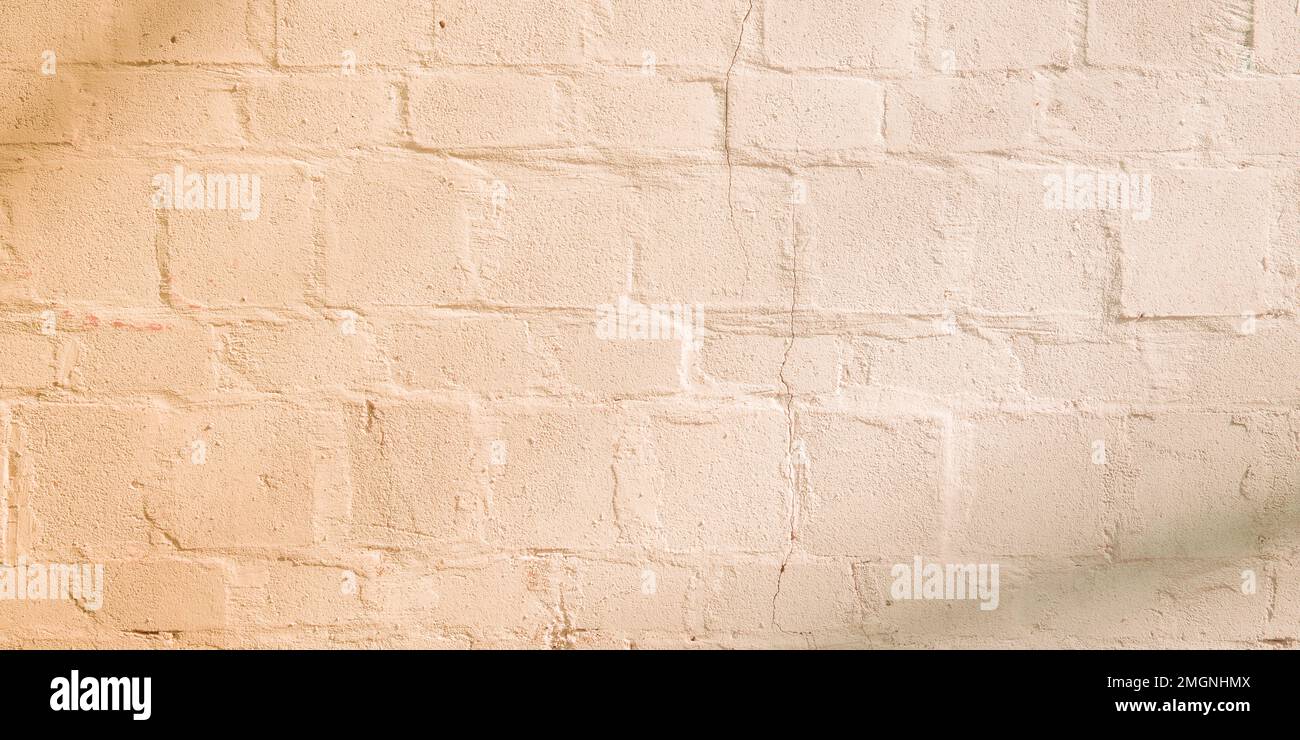 old wall beige background with old brick bricks Stock Photo - Alamy
