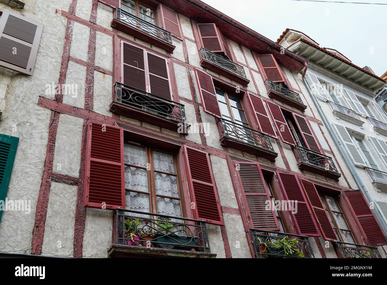 Premium Photo  Facade with doors and windows typical of the south of  france in the basque country bayonne