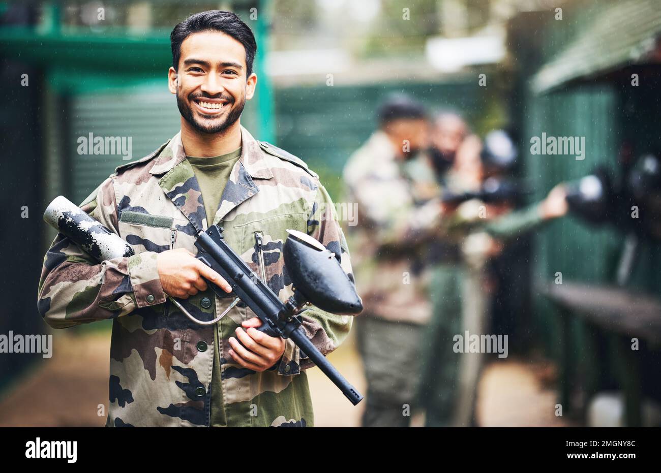 Paintball, gun and portrait of a man soldier in a camouflage military