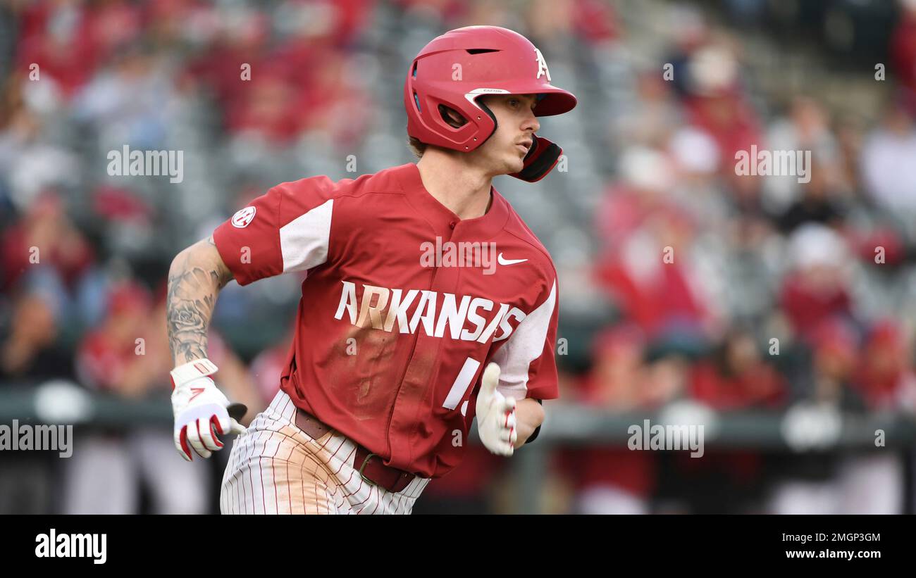 Arkansas batter Casey Martinruns to first base against Illinois State ...