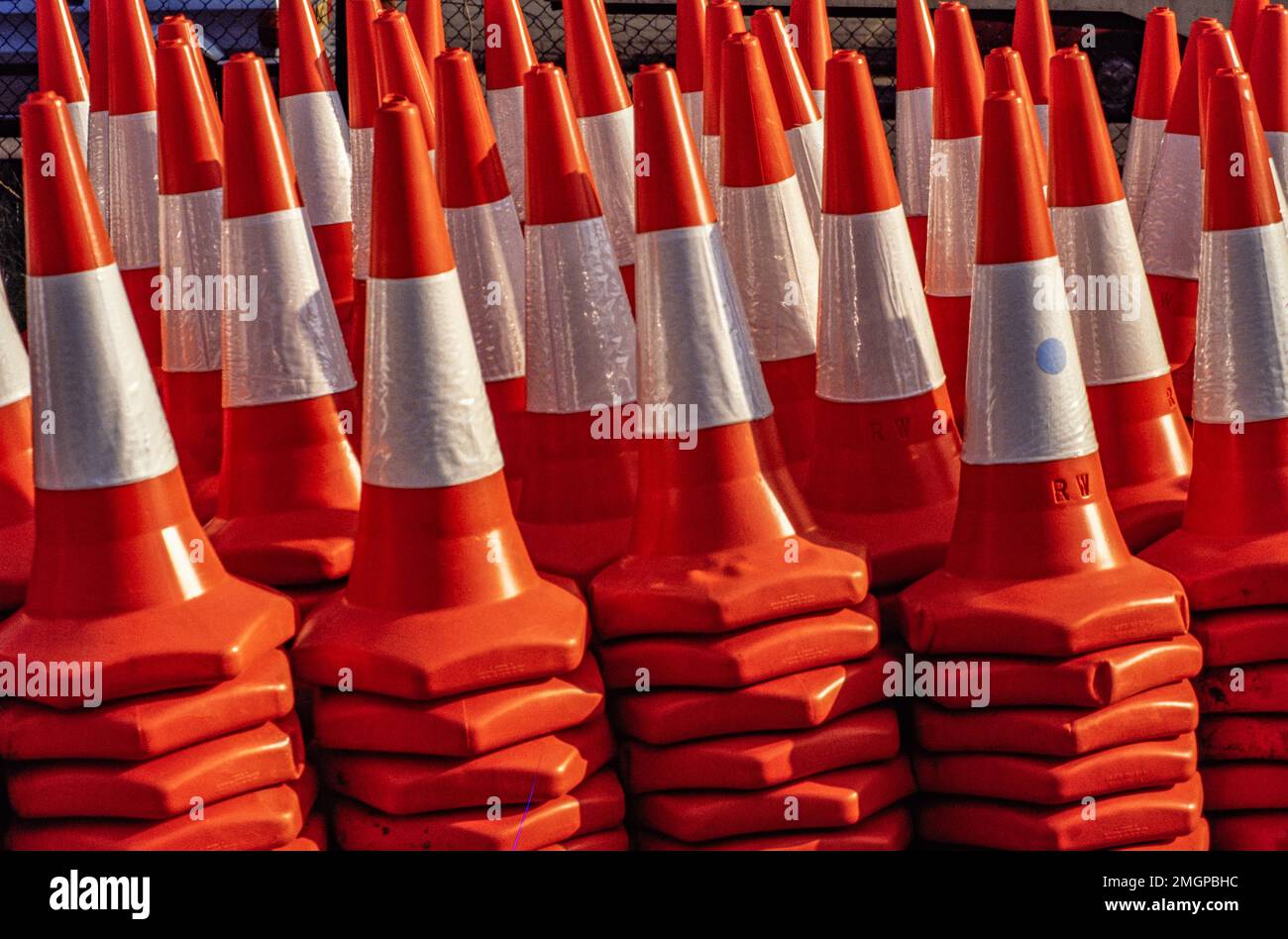 Orange traffic cones stacked in piles Stock Photo Alamy