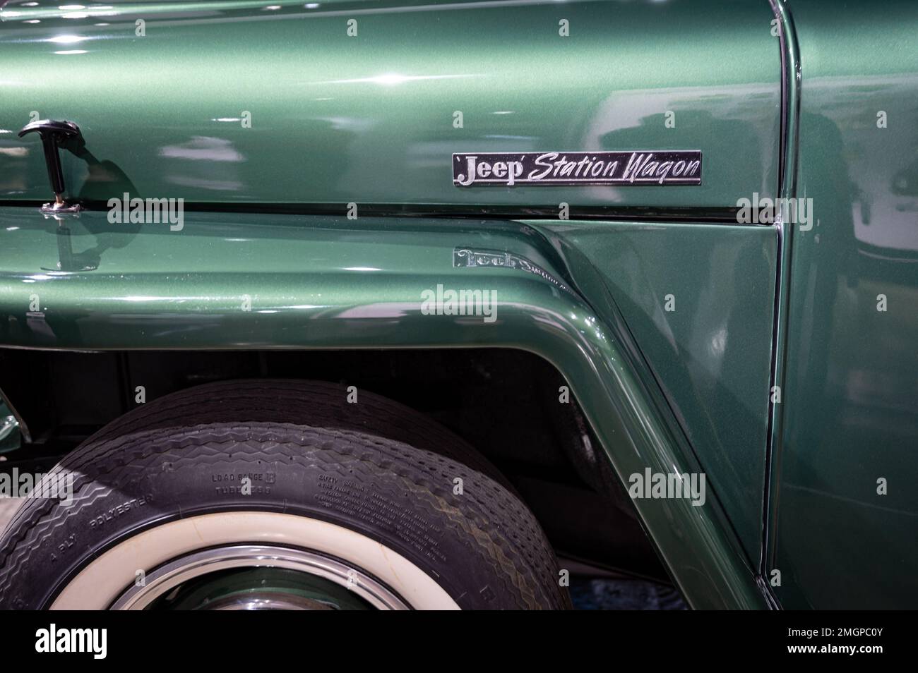 Green 1949 Jeep Station Wagon logo detail Stock Photo