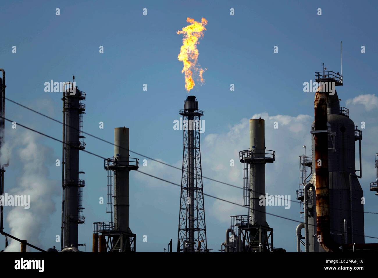 FILE - In this Thursday, Aug. 31, 2017, file photo, a flame burns at ...