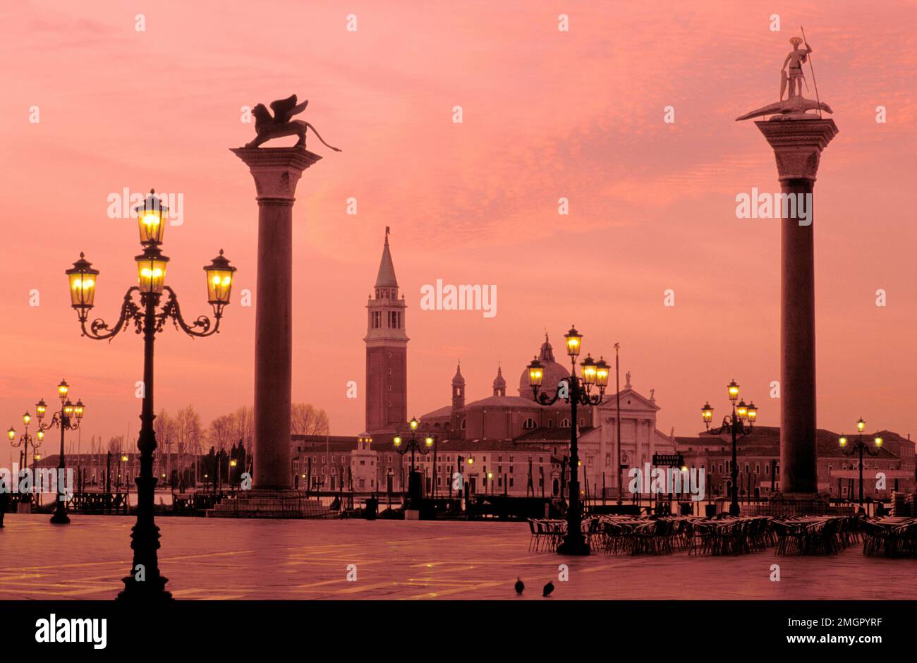 Italy,Venice,View of San Giorgio Maggiore from Piazzetta San Marco with the Column of San Marco and the Doge's Palace at dawn Stock Photo
