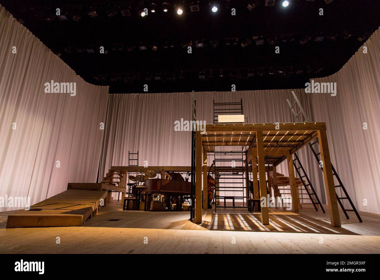 stage,set,empty,wood,wooden,platform,ladder,musical,instruments,curtain,ramp for JANE EYRE at the Lyttelton Theatre, National Theatre (NT), London SE1  17/09/2015  a co-production with the Bristol Old Vic  based on the novel by Charlotte Bronte   devised by the company   dramaturg: Mike Akers   composer & musical director: Benji Bower   set design: Michael Vale   costumes: Katie Sykes   lighting: Aideen Malone   movement: Dan Canham   director: Sally Cookson Stock Photo