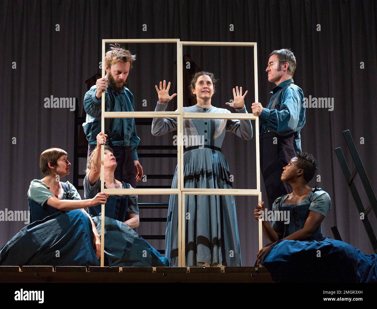 centre: Madeleine Worrall (Jane) in JANE EYRE at the Lyttelton Theatre, National Theatre (NT), London SE1  17/09/2015  a co-production with the Bristol Old Vic  based on the novel by Charlotte Bronte   devised by the company   dramaturg: Mike Akers   composer & musical director: Benji Bower   set design: Michael Vale   costumes: Katie Sykes   lighting: Aideen Malone   movement: Dan Canham   director: Sally Cookson Stock Photo