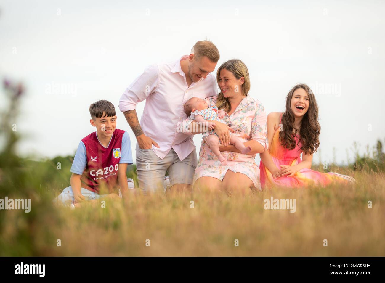 British white family looking happy and having fun outside Stock Photo