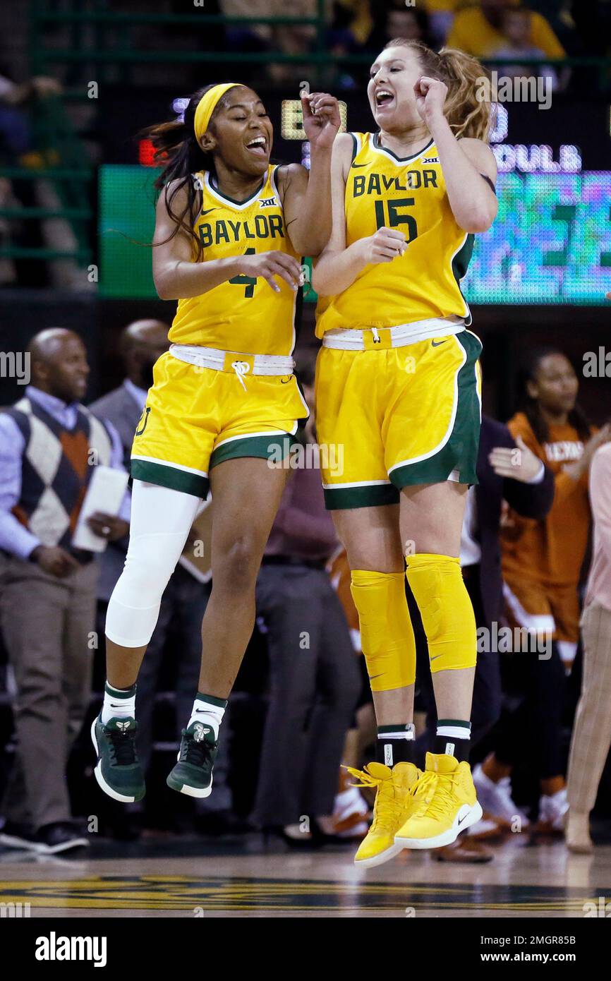 Baylor guard Te'a Cooper, left and forward Lauren Cox, right, jump at