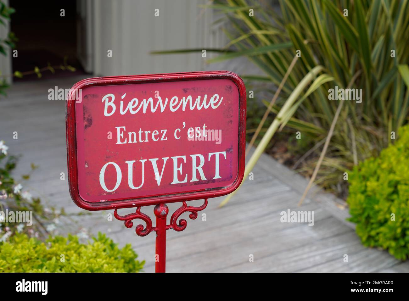 Sign at the entrance of a restaurant saying in French - Ouvert - meaning in  English - Open Stock Photo - Alamy